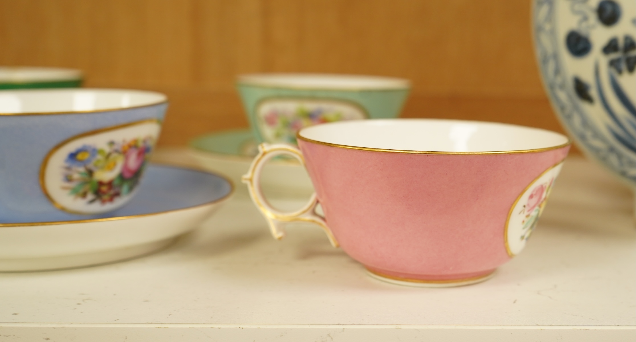 A Sevres style harlequin tea service for six, each saucer 13cm in diameter